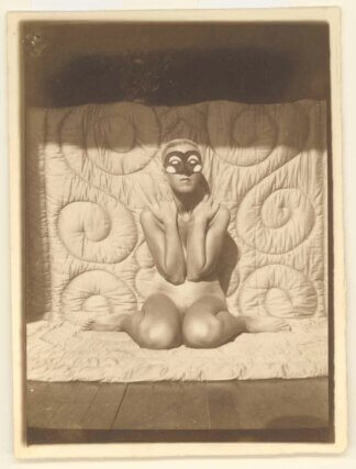 Claude Cahun, Self portrait (kneeling, naked, with mask), 1928. Courtesy of the Jersey Heritage Collections
