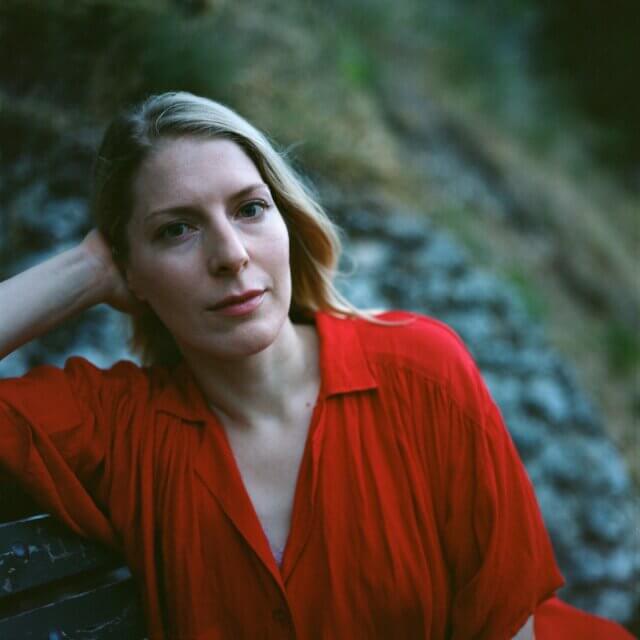 Photograph of Allison Katz in a red dress