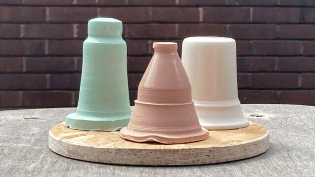 A top down view of various pastel coloured ceramic plates.