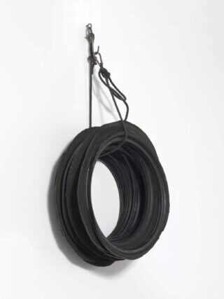 Phillip Lai. Untitled (12 tyre rims), 2012 / tyre parts, rope, amalgamating tape, eyescrew, shackle, metal hook, carbine / 102 × 60 × 22 cm.