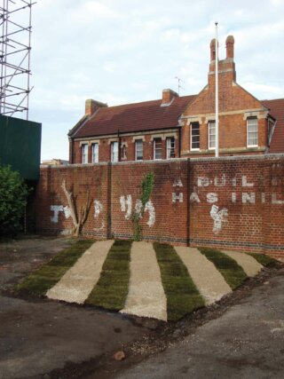 Rachael Champion, Riverview Court 2012. Site-specific installation of pea shingle and turf. Cultivation Field, The Keep, Reading