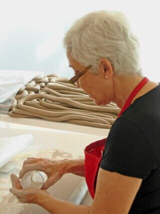 Anna Maria Maiolino working with clay for installation at 
Pharos Centre for Contemporary Art, Nicosia 2007. 
Photographer: Michael Asbury © the artist and Michael Asbury