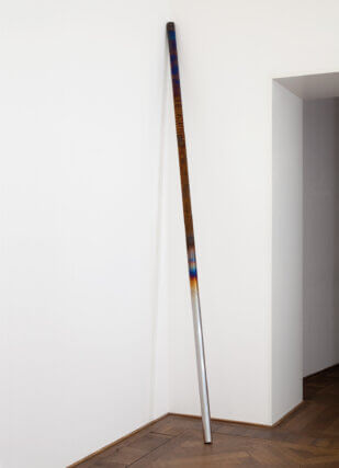 Raphael Hefti, From the series Replaying the Mistake of a Broken Hammer (Installation view, Kunsthalle Basel), 2011. 
Steel bar subjected to the different stages of the hardening process. The top section shows where the process has been interrupted, leaving it brittle like glass, 6 cm diameter x 300 cm length. © the artist