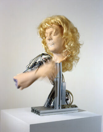 Urs Fischer, Airports are like Nightclubs, 2004. Mechanical robot, silicone, pigment, wig. Copyright Urs Fischer and courtesy of Galerie Eva Presenhuber, Zurich; Sadie Coles HQ, London and Gavin Brown’s enterprise, New York.