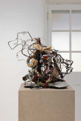 Lonnie Holley, 'The On and Off of Our Power,' 2001
Scrap metal, stone, wire, electrical wires, 
artificial plants, fabric, light switch, plastic, paper. 
Courtesy the artist, Edel Assanti and BLUM 
Photo: Rob Harris