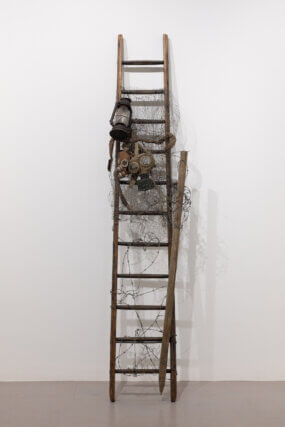 Lonnie Holley, 'Foxhole', 2024. Gas masks, wooden stairs. Courtesy the artist, Edel Assanti and BLUM.
Photo: Rob Harris